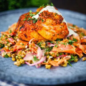 Baked tandoori cod loin with mint raita and mung bean salad.