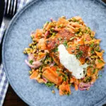 Overhead tandoori cod fish with raita and a mung bean salad.