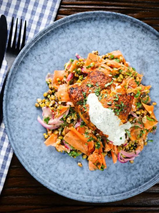 Overhead tandoori cod fish with raita and a mung bean salad.