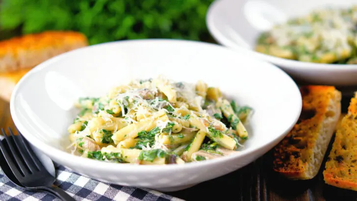 Creamy spinach and mushroom casarecce pasta served with garlic ciabatta bread.