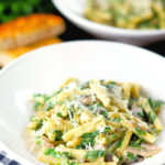 Spinach and mushroom pasta with parmesan cheese and garlic bread.
