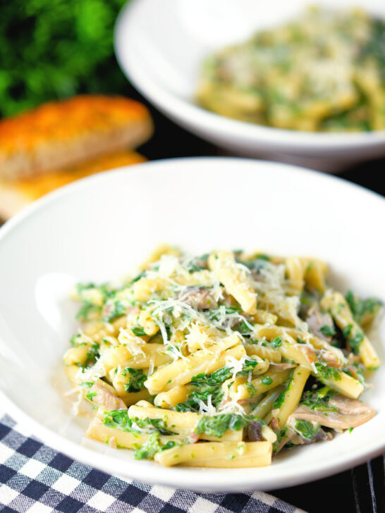 Spinach and mushroom pasta with parmesan cheese and garlic bread.