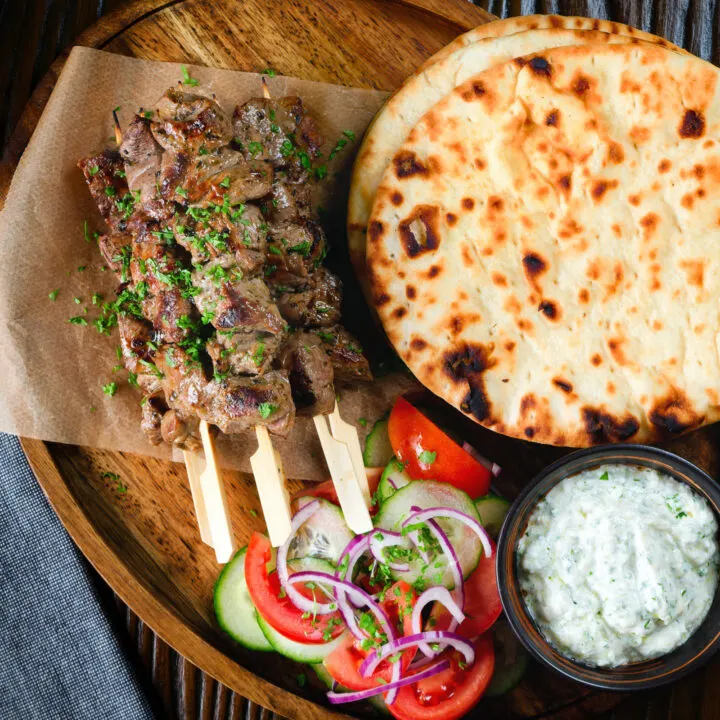 Marinated Greek lamb souvlaki served with tzatziki, salad and flatbreads.
