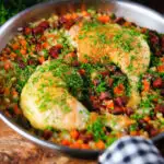 Spanish-influenced baked chicken and chorizo rice in a cooking pan.