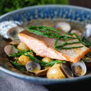Pan fried sea trout with clams, Jersey Royal potatoes and samphire.