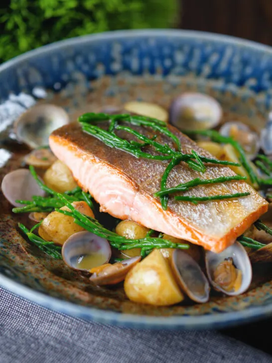 Pan fried sea trout fillet with clams, new potatoes and fresh samphire.