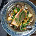 Overhead pan fried sea trout fillet with clams, new potatoes and fresh samphire.