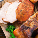 Overhead close-up carved slow cooker (Crockpot) pork loin.