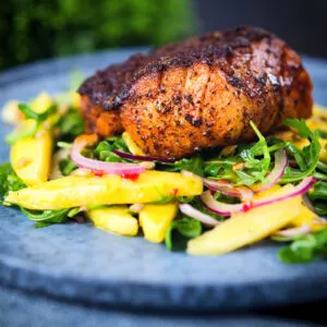 Cajun-influenced blackened cod loin served with a spicy mango salad.