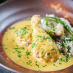 Chicken drumstick rezala curry serve with jeera (cumin) rice.