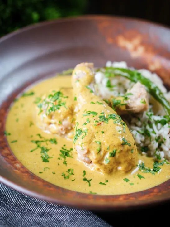 Chicken drumstick rezala curry serve with jeera (cumin) rice.