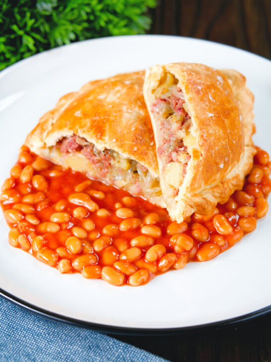Homemade corned beef, onion and potato pasty served with baked beans.