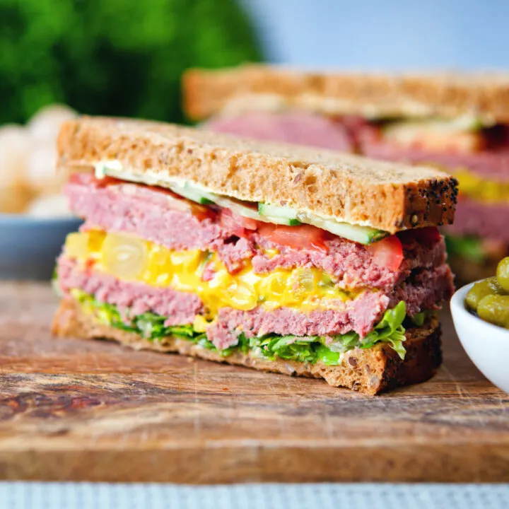 Canned corned beef sandwich with piccalilli, lettuce, cucumber and tomato.