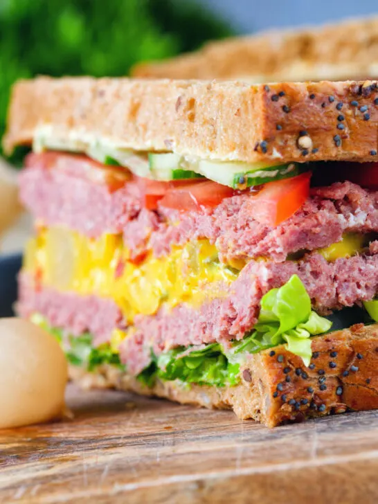 Canned corned beef sandwich with piccalilli on wholegrain seeded bread.