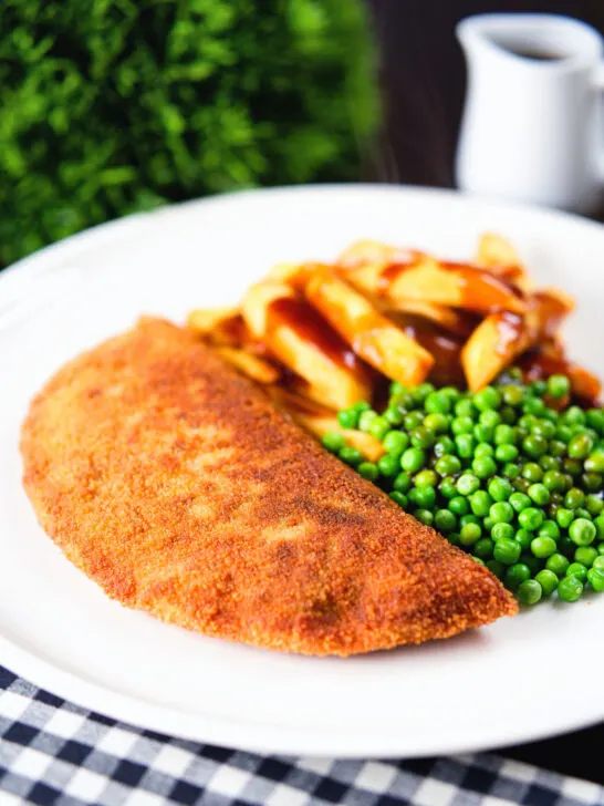 Homemade minced beef filled crispy pancakes served with chips, peas and gravy.