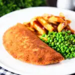 Homemade minced beef filled crispy pancakes served with chips, peas and gravy.