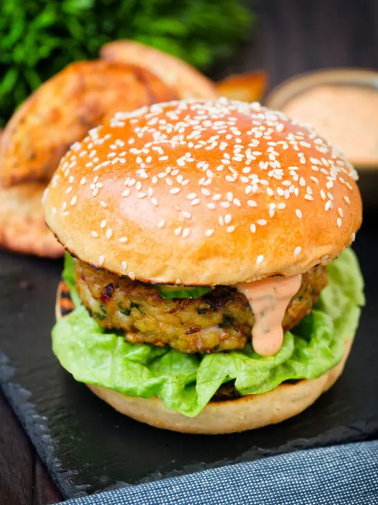 Fish burger with Thai flavours topped with sriracha mayonnaise and cucumber.