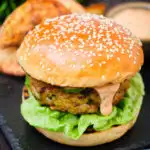 Fish burger with Thai flavours topped with sriracha mayonnaise and cucumber.