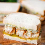 Fish finger sandwich with homemade tartar sauce and gherkins.