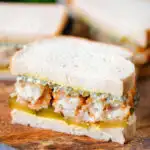 Fish finger sandwich with homemade tartar sauce and gherkins.
