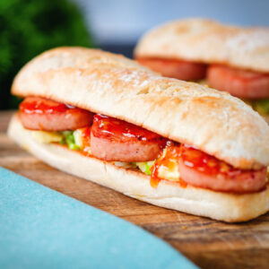 Fried spam, scrambled egg and spring onion sandwich with sweet chilli sauce.