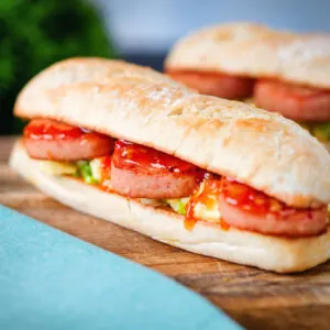 Fried spam, scrambled egg and spring onion sandwich with sweet chilli sauce.