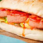 Spam, scrambled egg and spring onion sandwich served with Thai sweet chilli sauce.