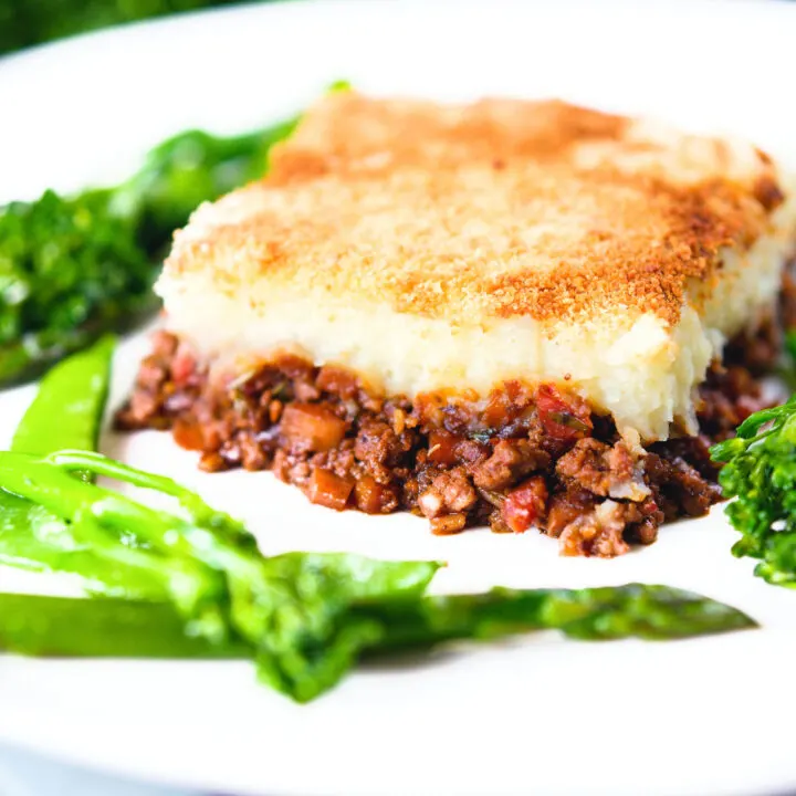 French Hachis Parmentier (cottage pie) served with sauteed green vegetables.