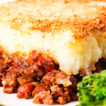 Close-up French Hachis Parmentier with a mashed potato & breadcrumb topping.