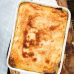 Overhead breadcrumb topped Hachis Parmentier in a baking dish.