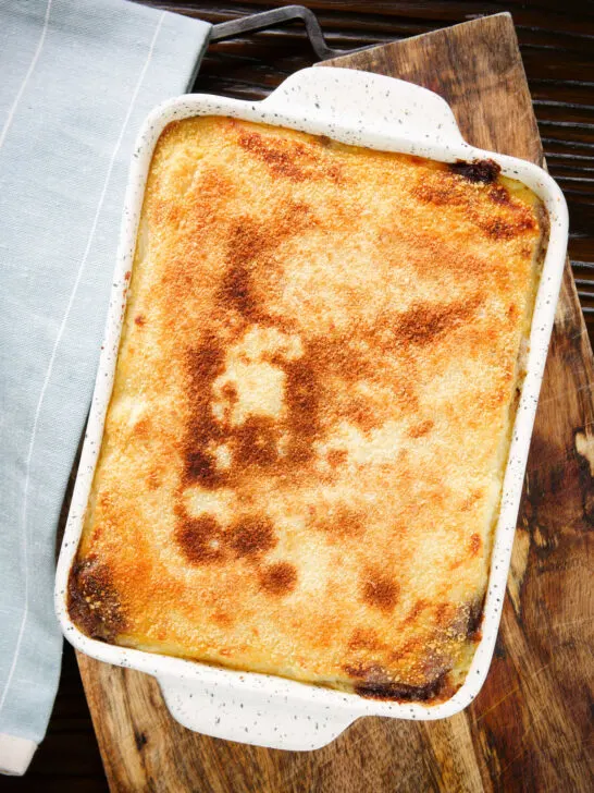 Overhead breadcrumb topped Hachis Parmentier in a baking dish.