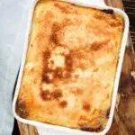 Overhead breadcrumb topped Hachis Parmentier in a baking dish.