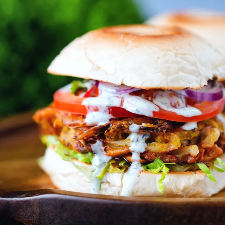 Onion bhaji burger topped with tomato, onion, cucumber, chilli and mint raita.