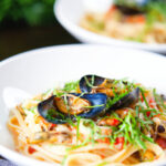 Mussels with pasta (linguine) in butter and white wine with garlic, chilli and tomatoes.