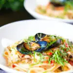 Mussels with pasta (linguine) in butter and white wine with garlic, chilli and tomatoes.