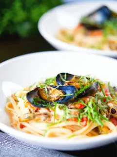 Mussels with pasta (linguine) in butter and white wine with garlic, chilli and tomatoes.