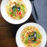 Overhead mussels with pasta (linguine) in butter and white wine with garlic, chilli and tomatoes.