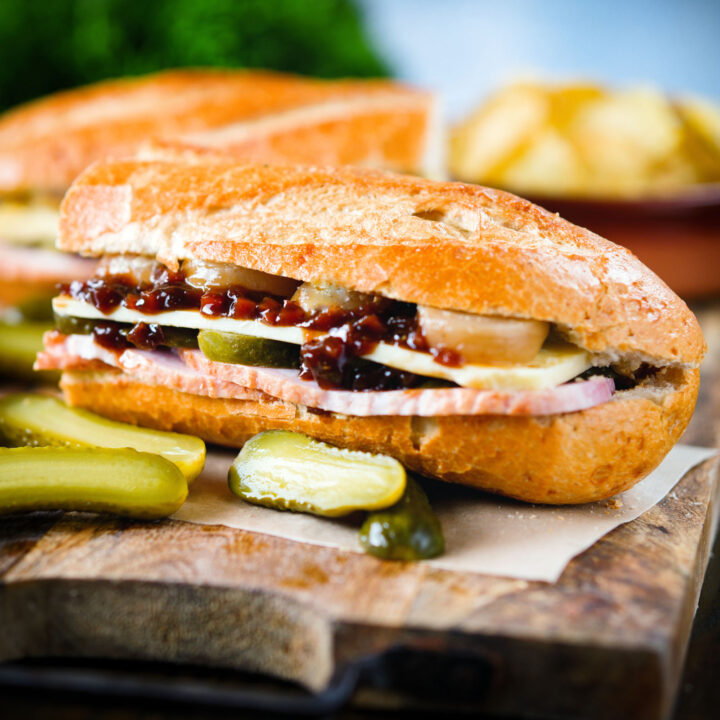Ploughman's lunch sandwich with ham, cheese, pickled onions and Branston Pickle.