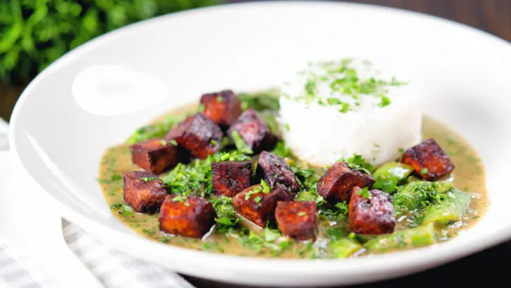 Vegan crispy tofu Thai green curry served with jasmine rice.