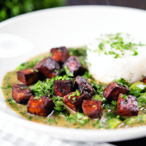 Vegan crispy tofu Thai green curry served with jasmine rice.