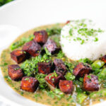 Crispy tofu Thai green curry with fresh herbs and jasmine rice.