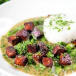 Crispy tofu Thai green curry with fresh herbs and jasmine rice.