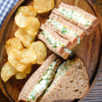 Overhead boiled egg and cress sandwiches with mayonnaise on wholemeal seeded bread.