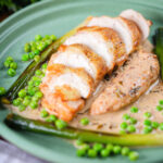 Sliced chicken breast in a creamy cider sauce served with baby leeks and peas.