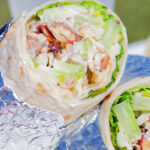 Chicken Waldorf salad wraps in flour tortillas.