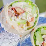 Chicken Waldorf salad wraps in flour tortillas.