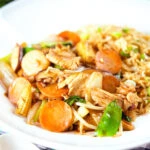 Homemade Chinese chicken chop suey fakeaway served with egg fried rice.
