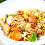 Homemade Chinese chicken chop suey fakeaway served with egg fried rice.