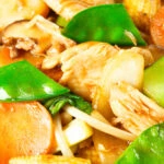Close-up homemade Chinese chicken chop suey fakeaway served with egg fried rice.
