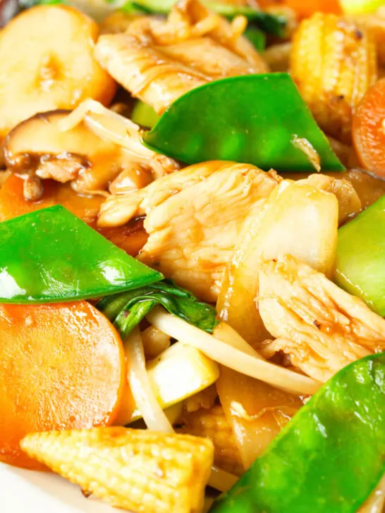 Close-up homemade Chinese chicken chop suey fakeaway served with egg fried rice.